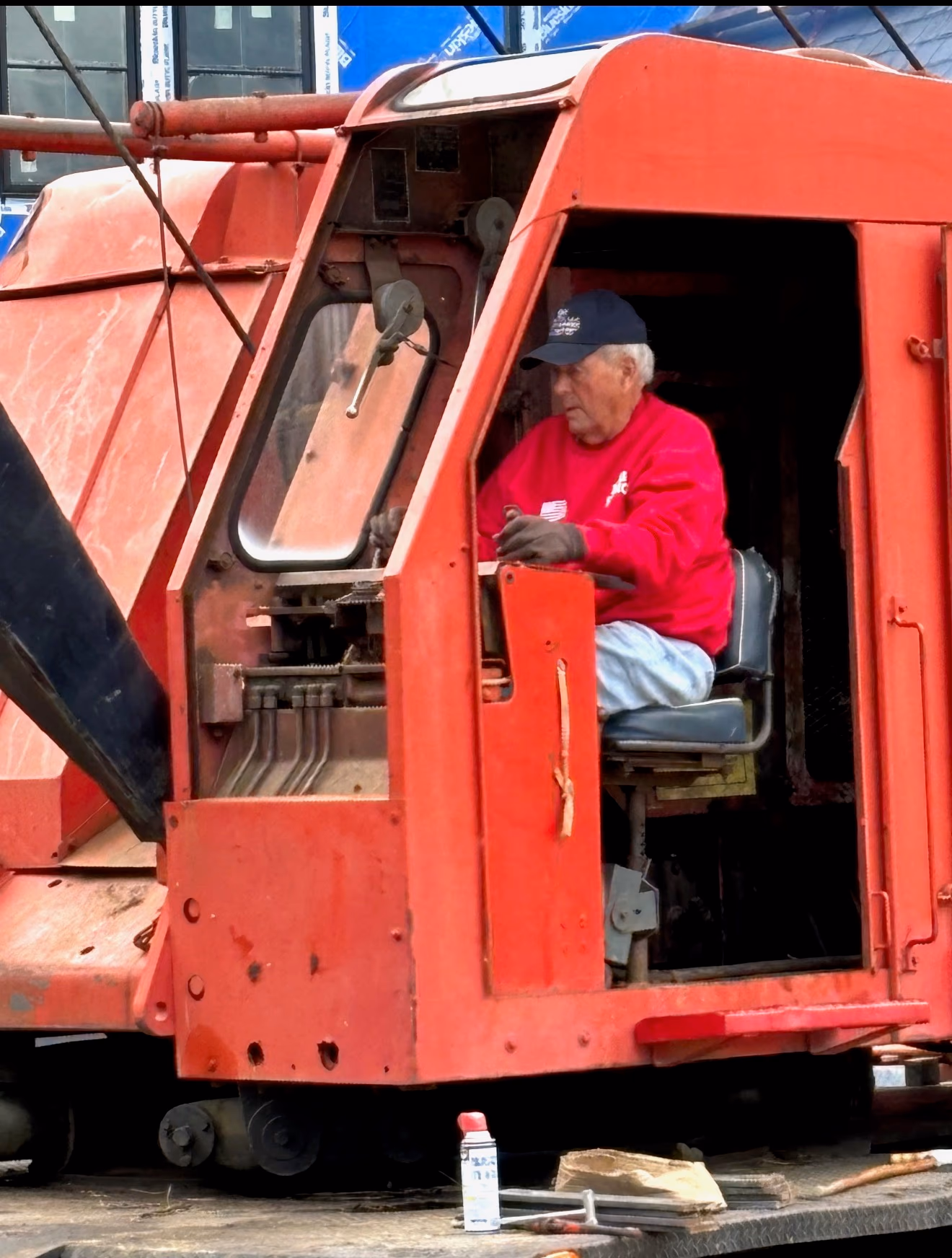 D.C. Crane Service — crane operator at the controls on a job site